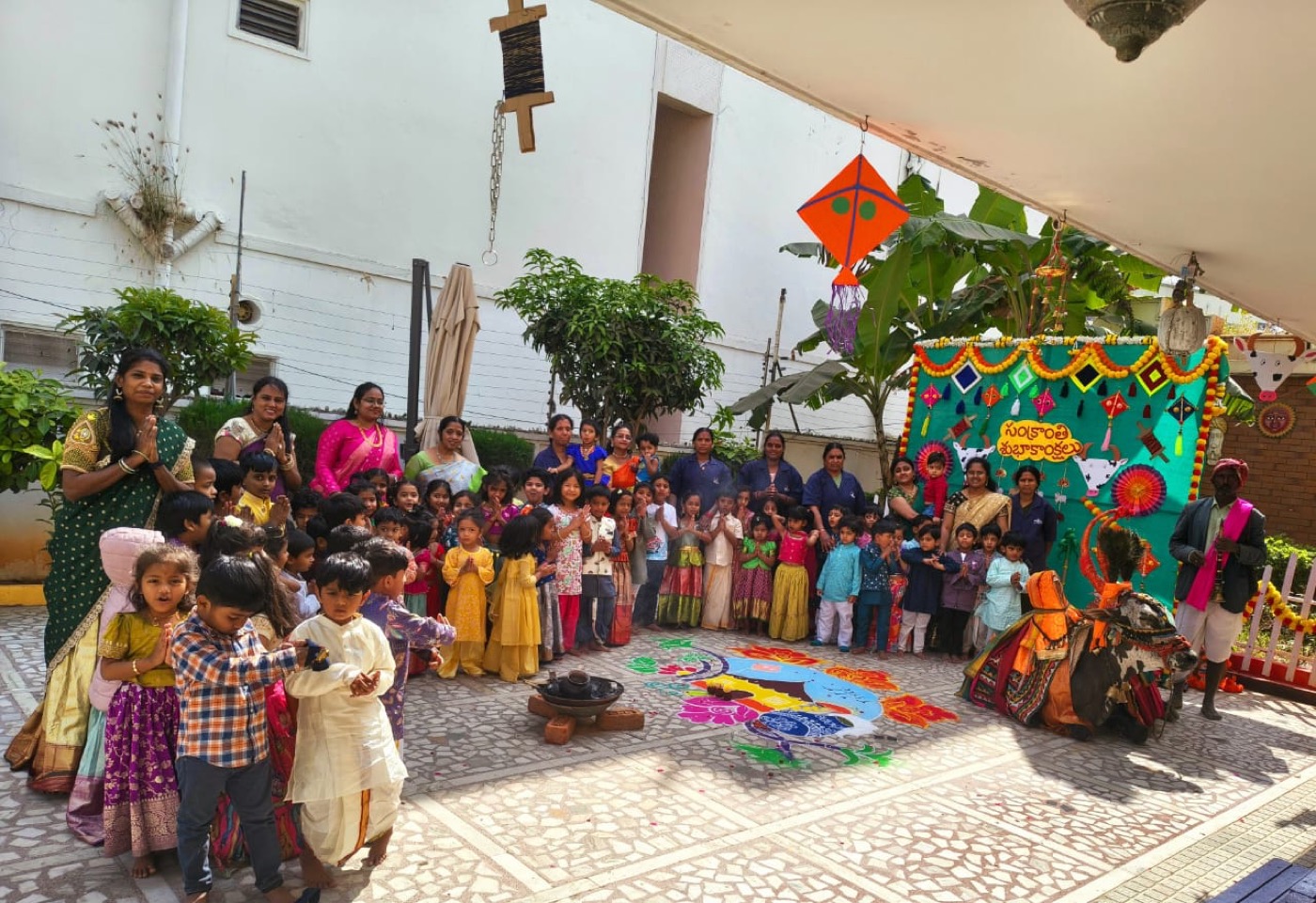 A teacher with students at The Platos